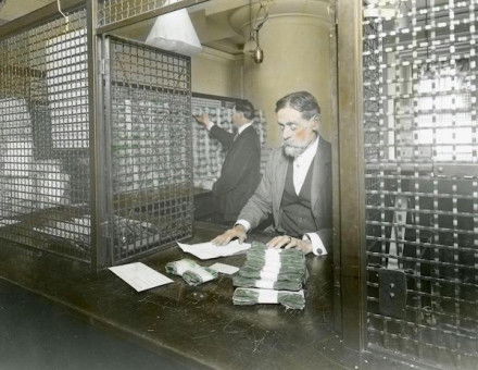 The receiving cashier’s cage at the US Treasury, to which money is returned after verification, late 19th-early 20th century. piemags/N23/Alamy Stock Photo.