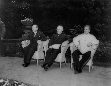 British prime minister Clement Attlee, US president Harry Truman, and Soviet leader Joseph Stalin, seated outdoors at Berlin conference, 1945. Library of Congress. Public Domain.