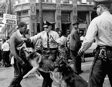 A civil rights activist is attacked by police dogs in Birmingham, Alabama, May 1963