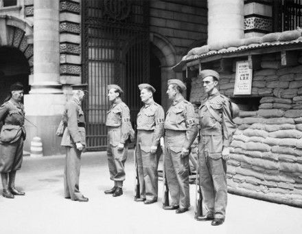 Local Defence Volunteers: The first manned Local Defence Volunteers (LDV) post in central London. The men pictured are being inspected by General Nation and Major Hughman.