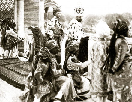 George V and Queen Mary watching the Delhi Durbar from the Red  Fort, accompanied by Indian princes acting as pages, 1911.