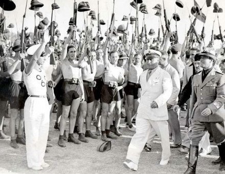 Benito Mussolini and Fascist Blackshirt youth in 1935.