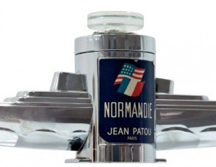 A chrome bottle of perfume in the shape of SS Normandie housed a scent created by Jean Patou, 1935.