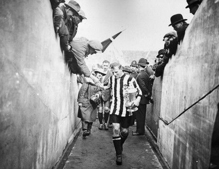 Frank Hudspeth carries the FA Cup after Newcastle United's win against Aston Villa in 1924. Topical Press Agency / Getty Images