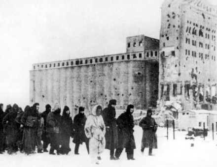 German soldiers as prisoners of war. In the background is the heavily fought-over Stalingrad grain elevator