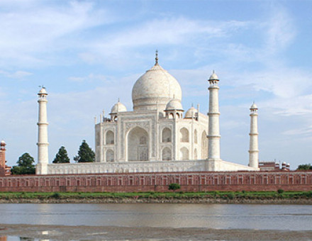 Taj Mahal and outlying buildings as seen from across the Yamuna River