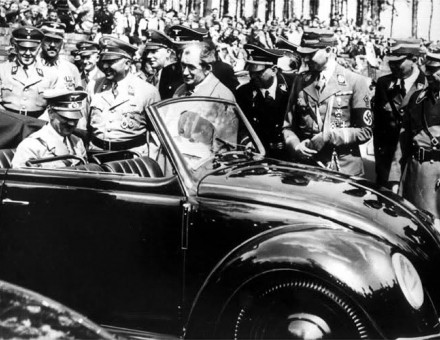 Hitler inside an early VW Beetle.