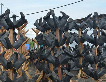 Rubber boots at a Médecins Sans Frontières medical centre, Monrovia, October 18th, 2014. Zoom Dosso / Stringer / Getty Images