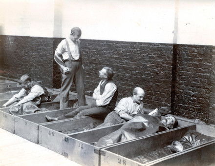 Men in 'coffin beds'.