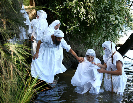 Mandeans perform a baptism ceremony in the River Nepean, Sydney, Australia