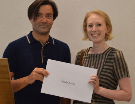 Emily Jones receives her prize from editor Paul Lay. 