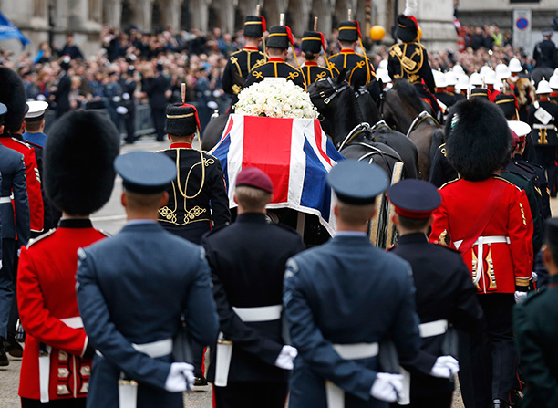 To praise or bury? Baroness Thatcher's coffin is carried on a gun carriage during her funeral procession, London, April 17th, 2013. Getty/Matt Dunham